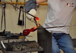 Complicated process of blowing glass